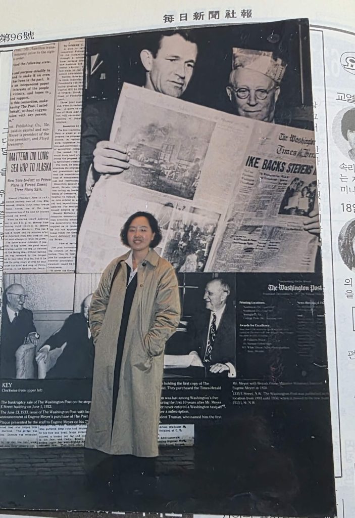 young journalist standing in front of The Washington Post display during early career