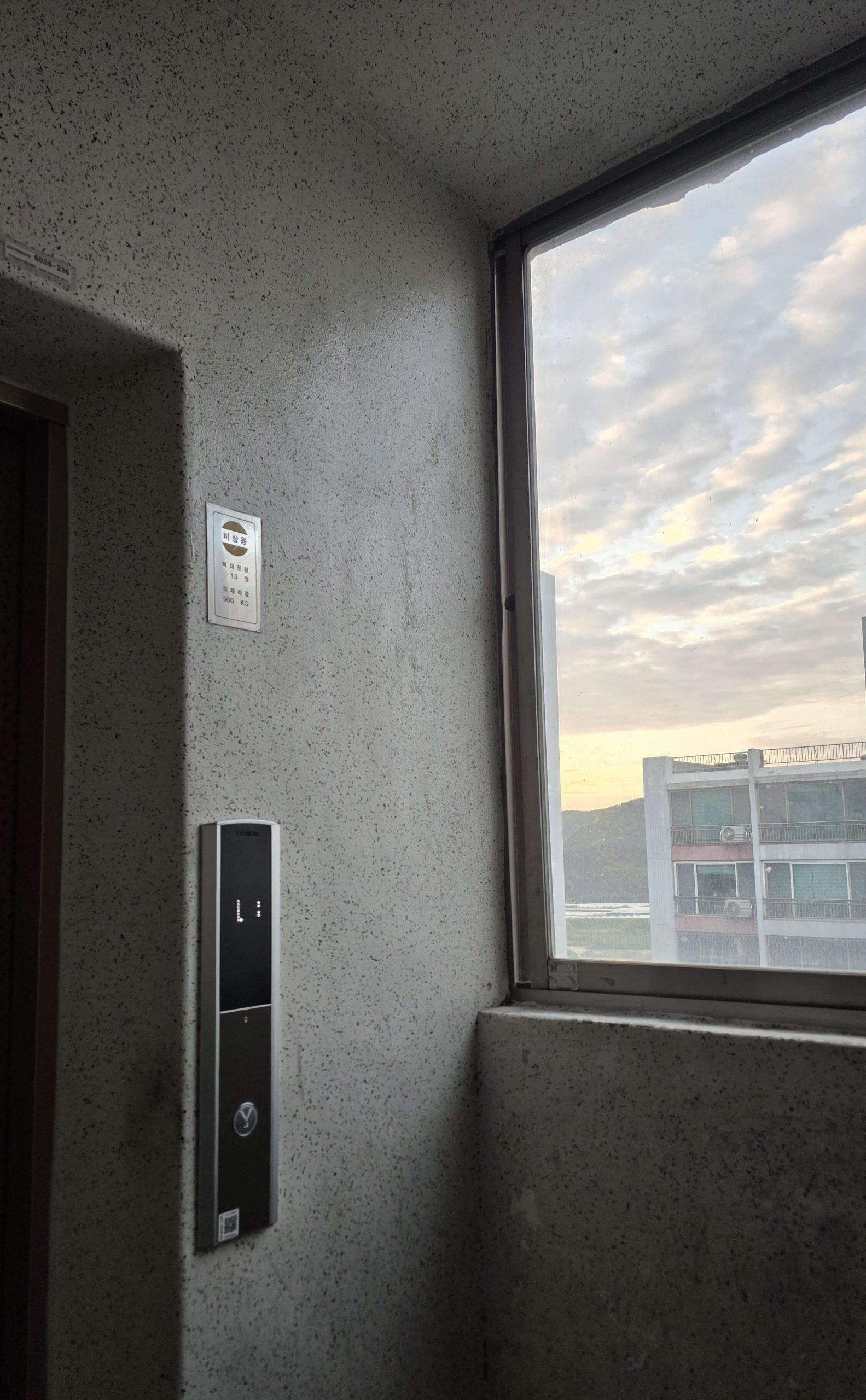 A quiet elevator moment during sunset for a simple reset reflection