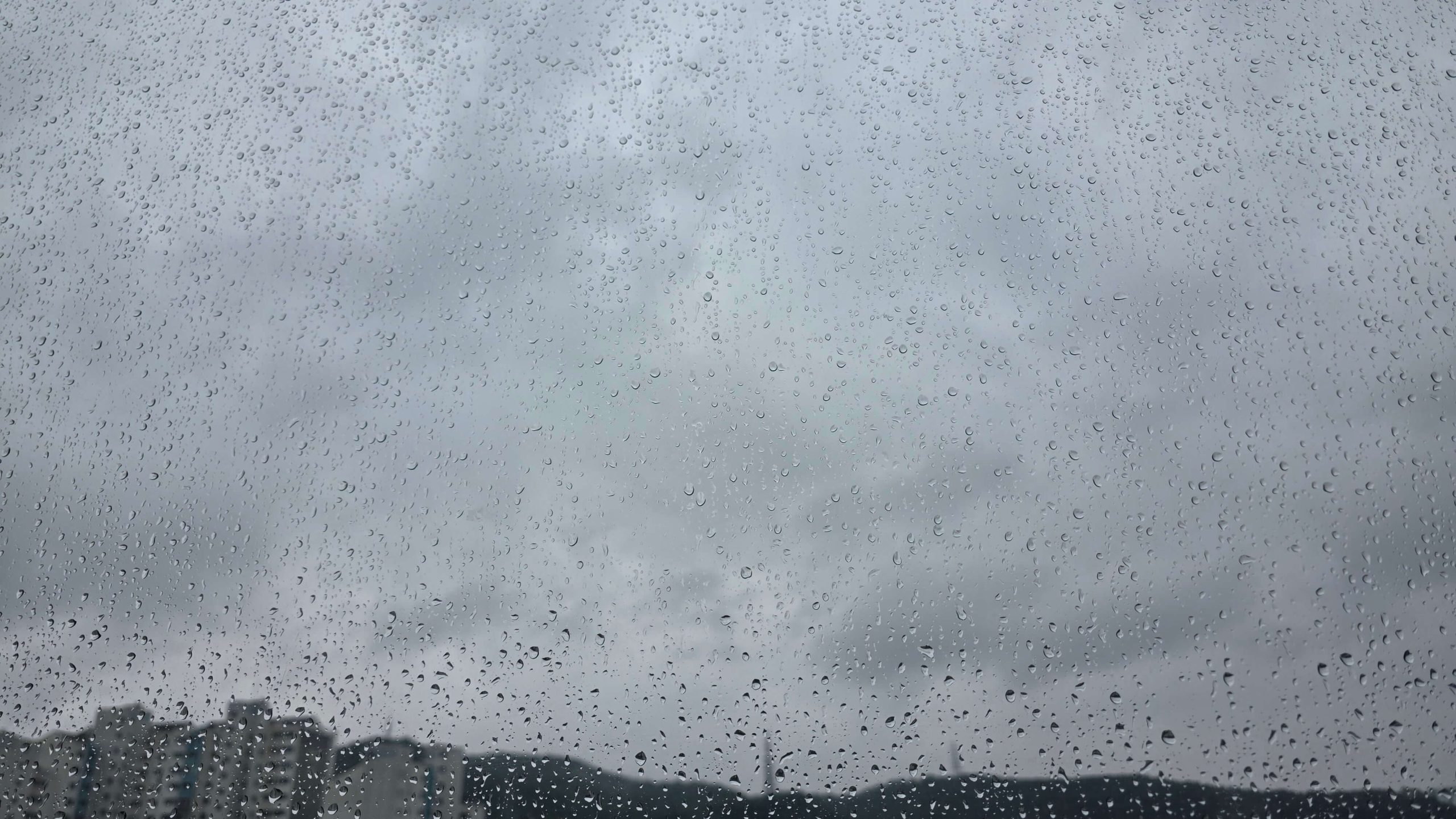 Raindrops on a window during a simple moment of self-awareness