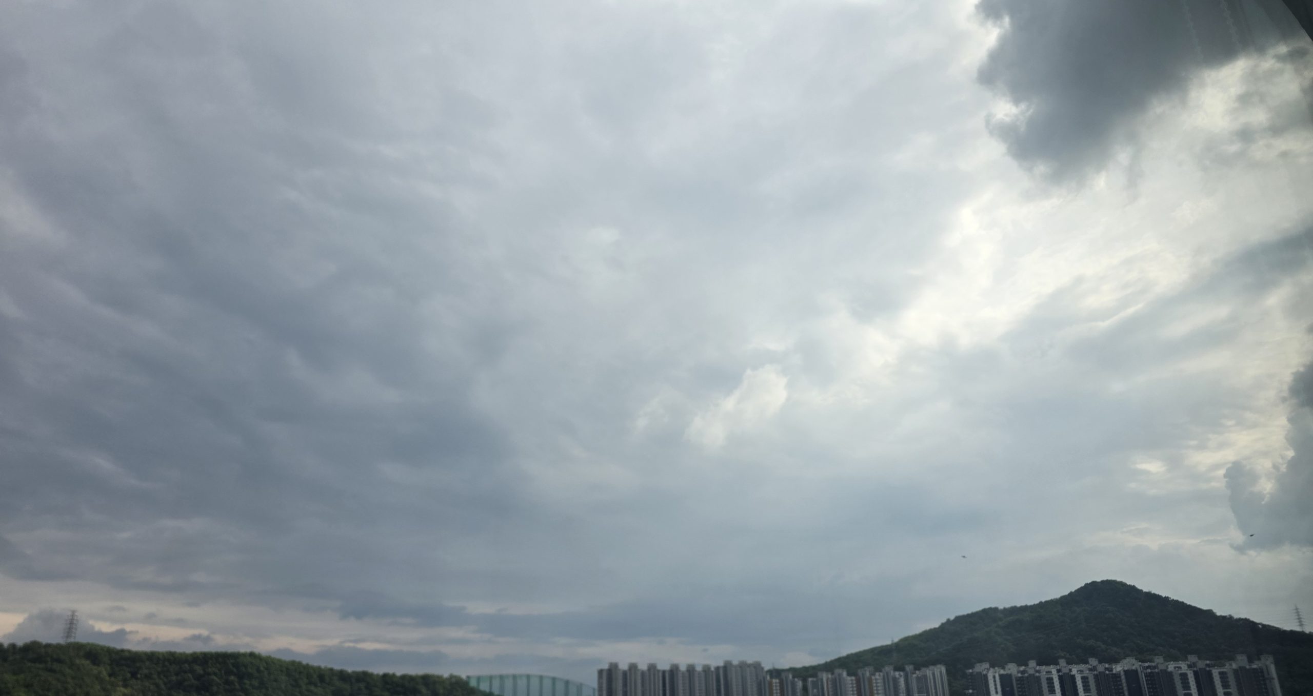 A quiet sky above the city, symbolizing the moment we stop adjusting and let life find its own balance.