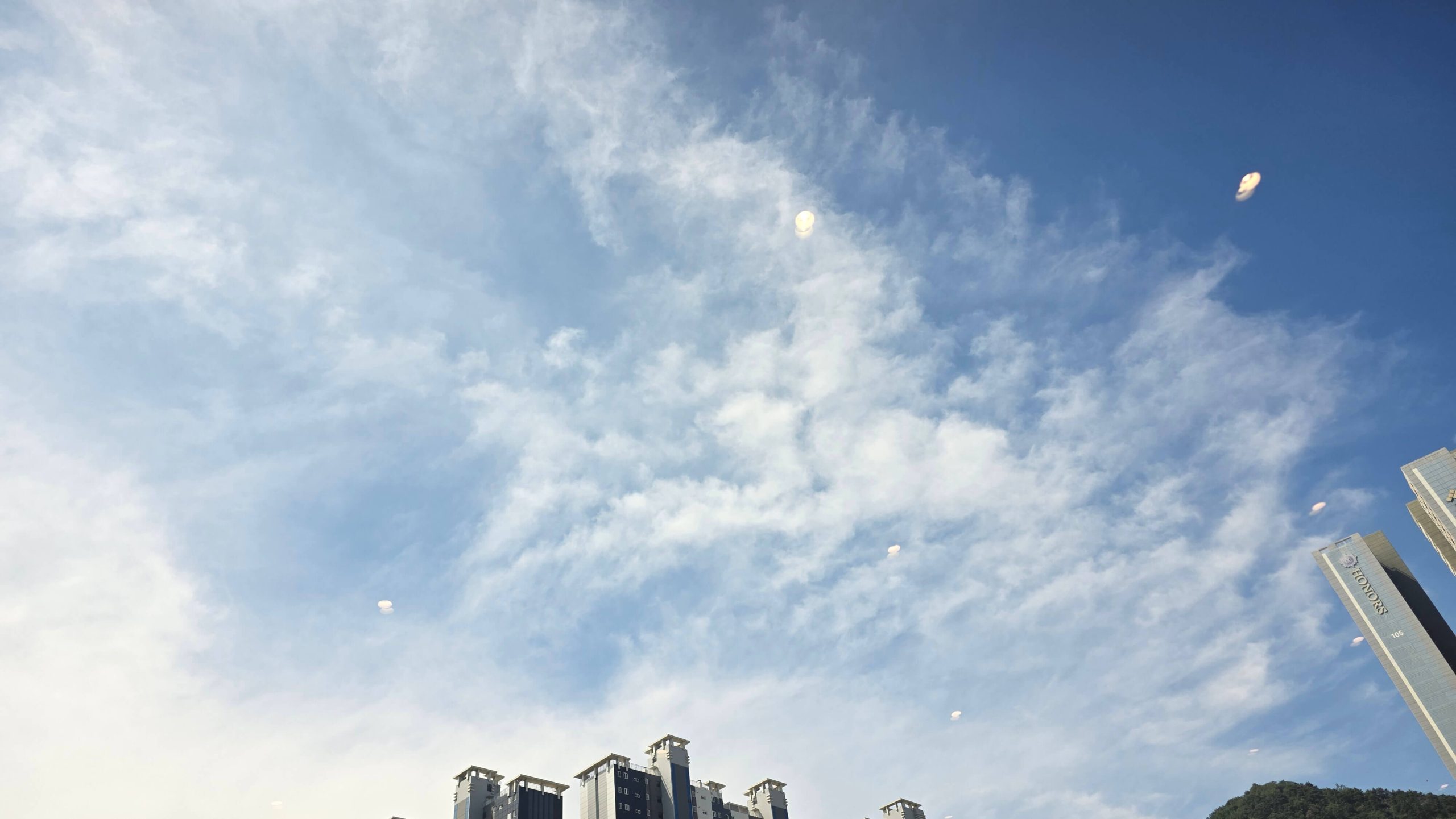 Blue sky with soft clouds, offering a quiet moment to pause and reflect on the everyday things we take for granted.