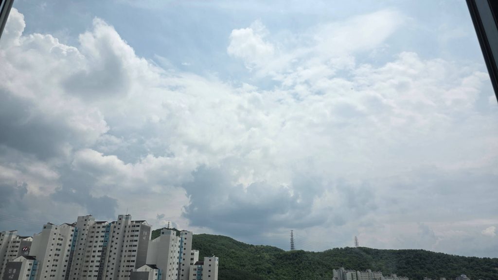 A cloudy sky seen from a veranda while stepping away from tension