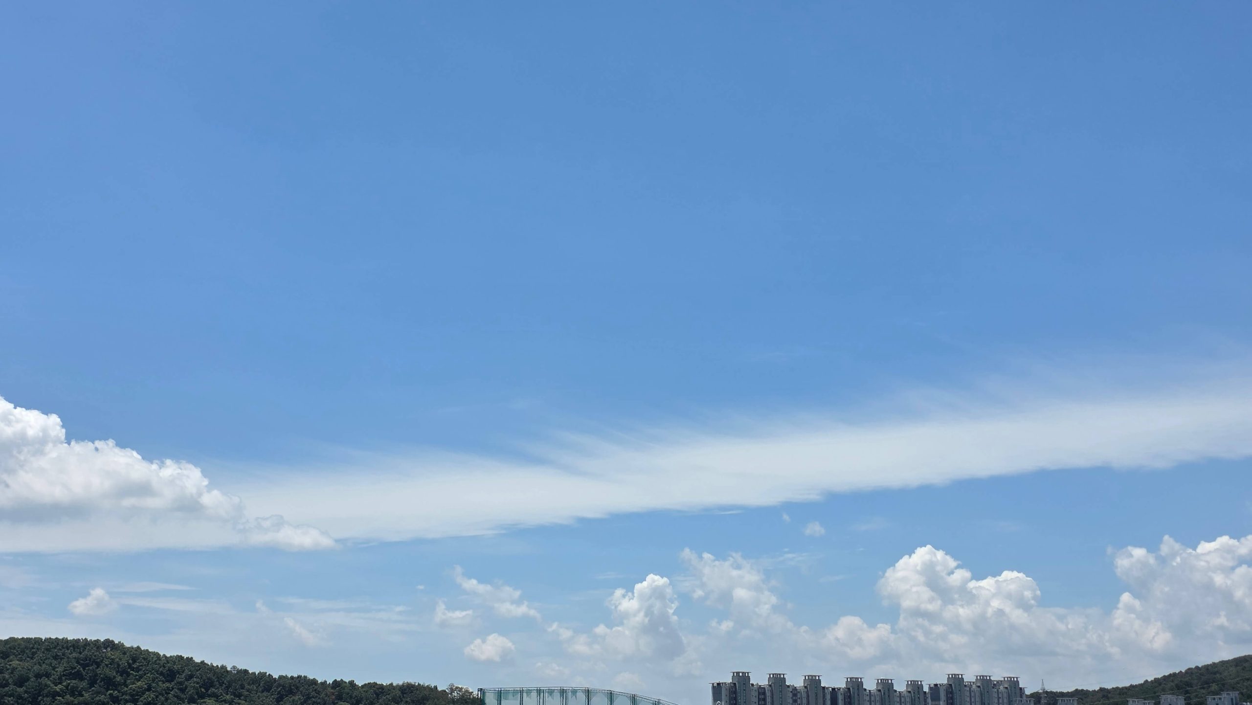 Open blue sky after the clouds begin to clear