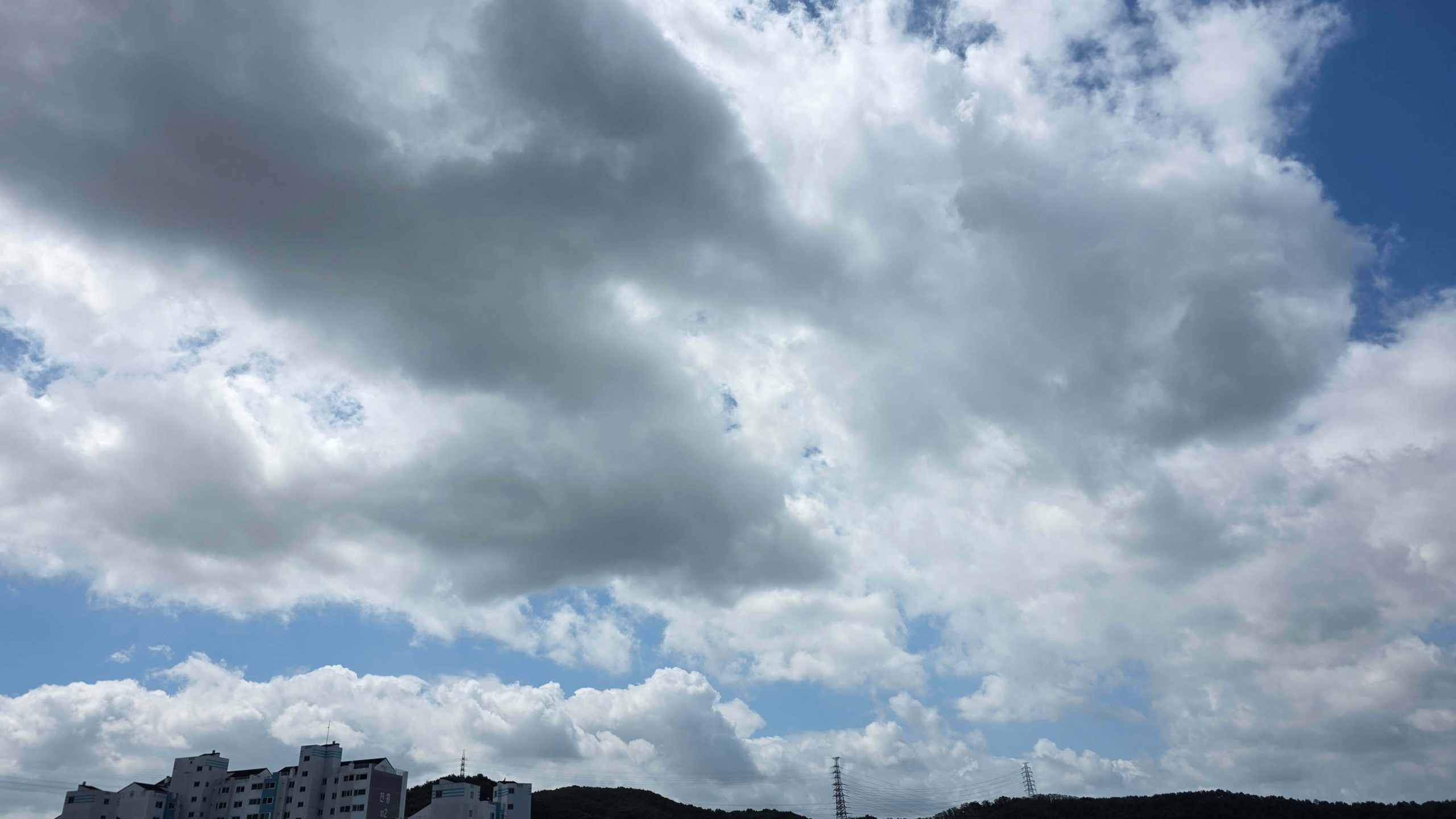 Clouds beginning to clear over a summer sky