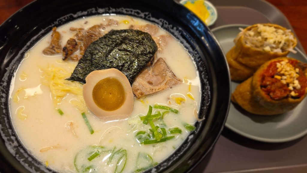 A bowl of ramen with inari sushi during lunch with my daughter