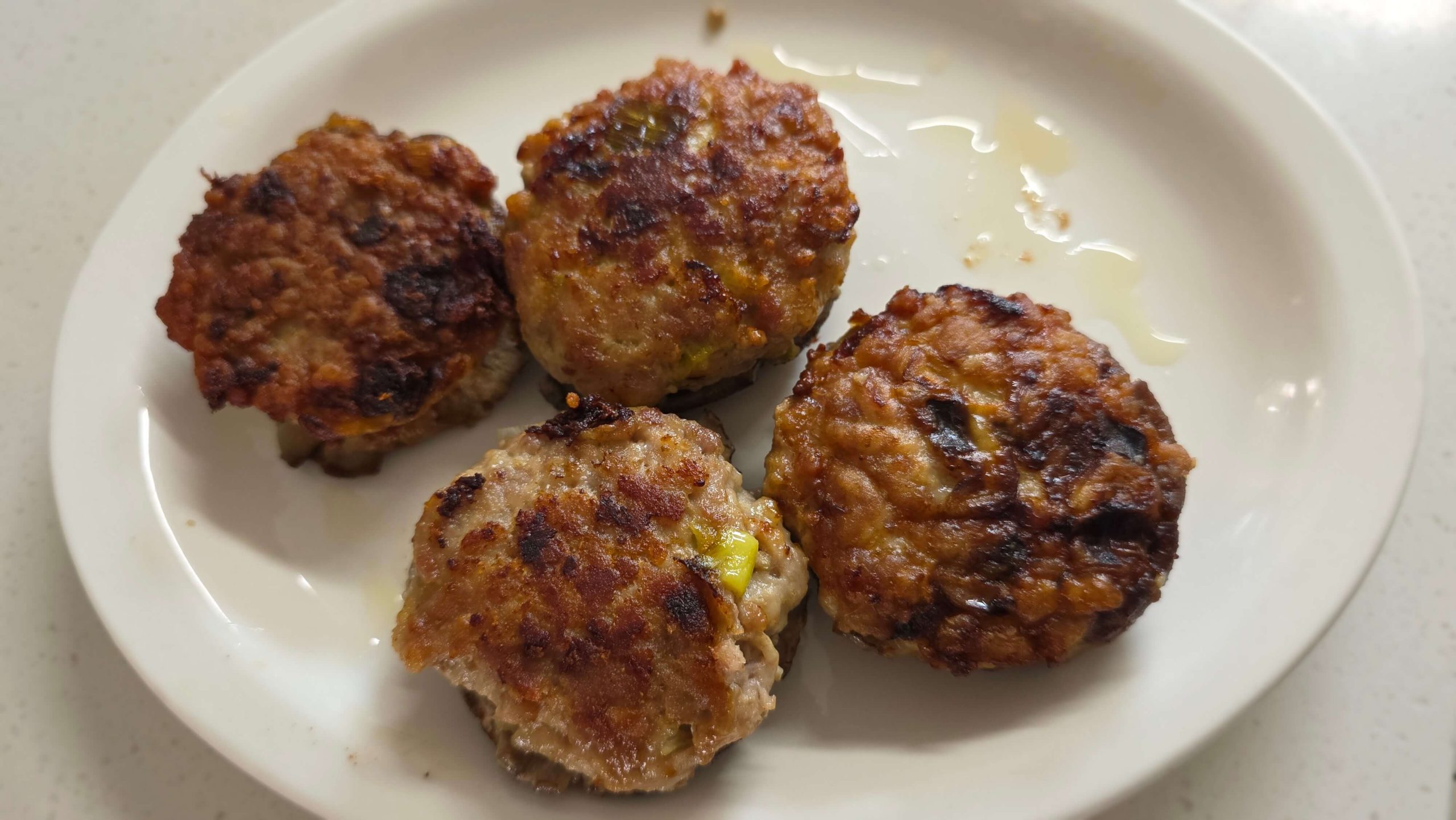Pan-fried shiitake mushrooms stuffed with seasoned pork
