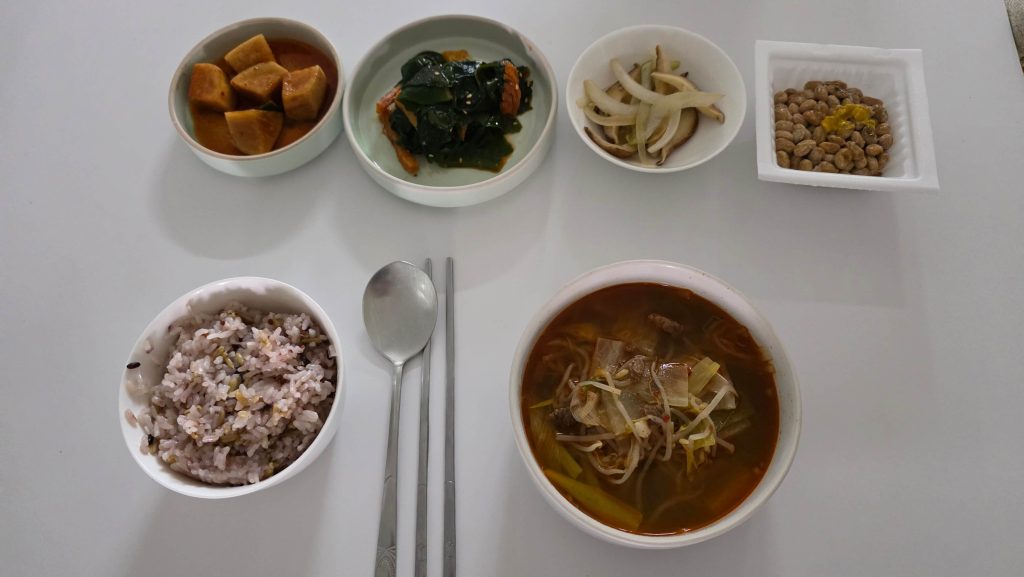 Lunch with spicy beef soup, multigrain rice, natto, and side dishes