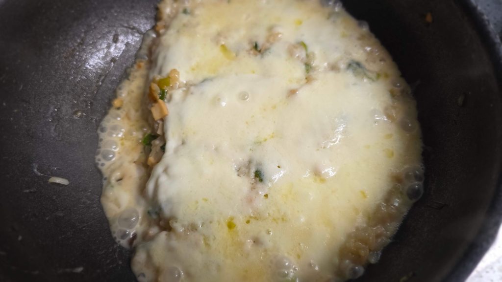 Soy sauce rice gratin with melted mozzarella after some of the moisture cooked off
