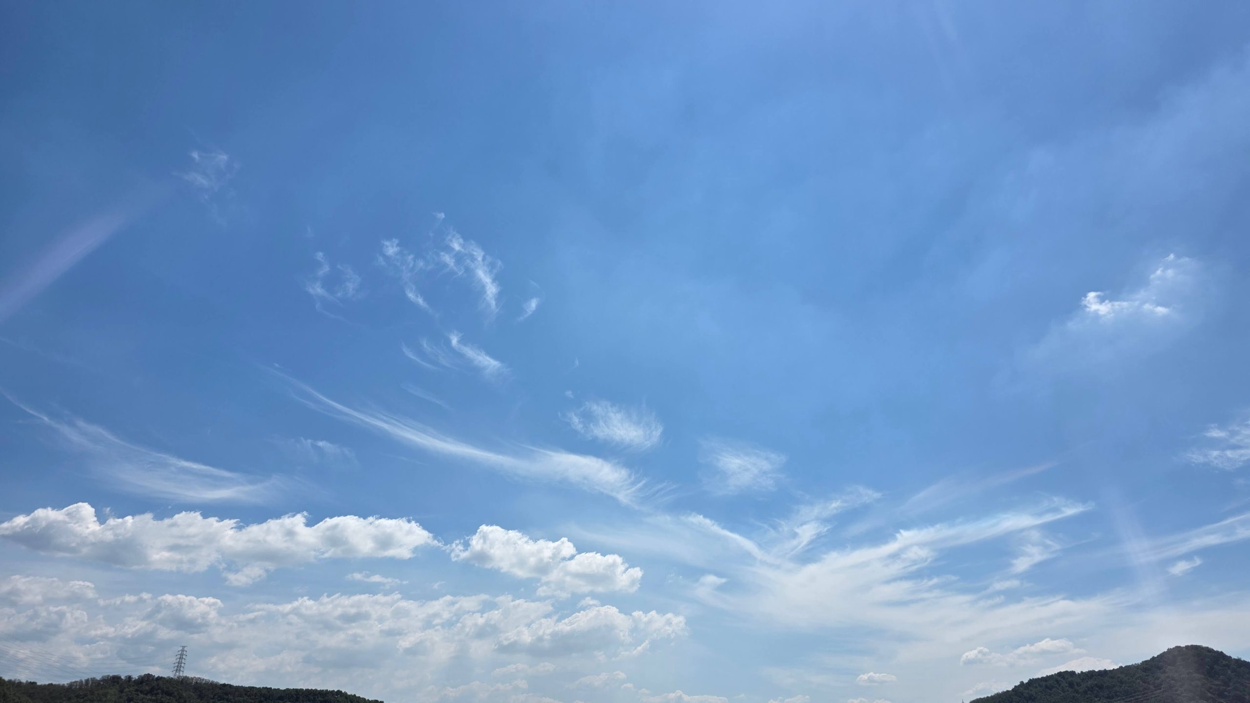 Blue summer sky above the mountains during a simple reset
