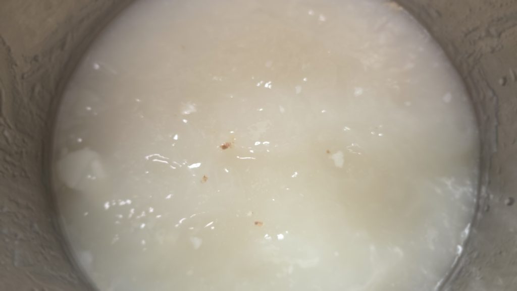 Chilled gomguk broth set like jelly after the fat was removed