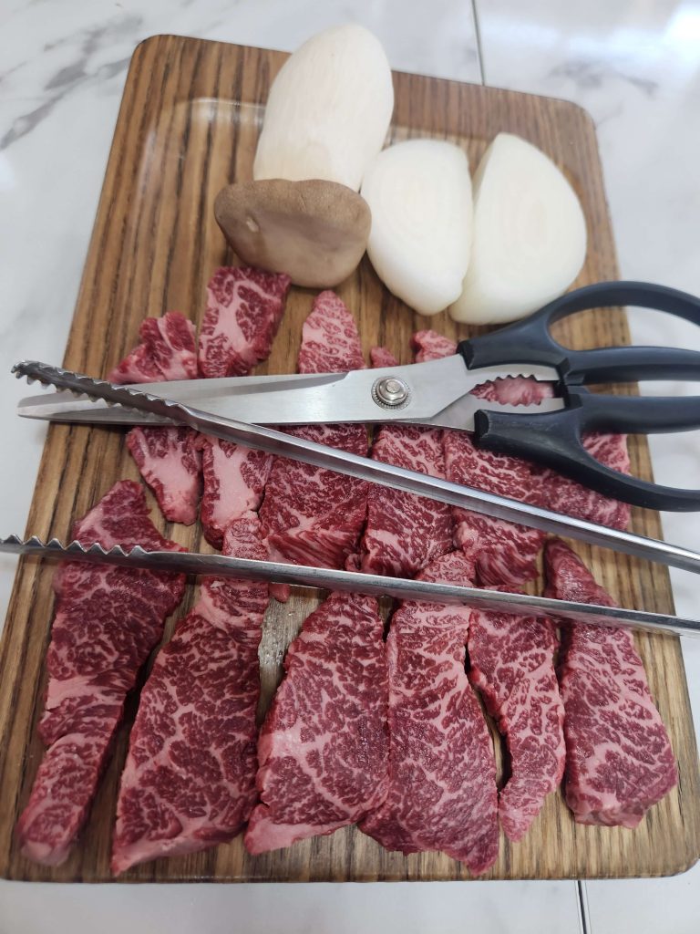 Sliced beef with mushrooms and onions at a quiet restaurant