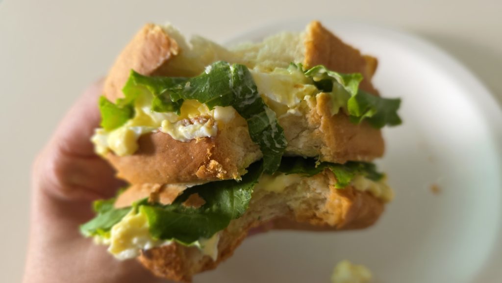 Homemade egg sandwich with lettuce on homemade bread